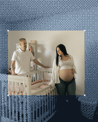 A couple expecting a baby, by the crib.